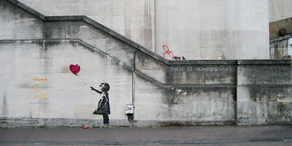 By Dominic Robinson from Bristol, UK - Banksy Girl and Heart Balloon, CC BY-SA 2.0, https://commons.wikimedia.org/w/index.php?curid=73570221